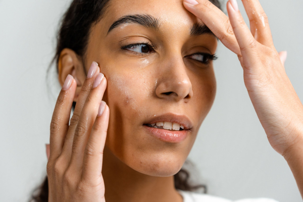 women rubbing in skin care